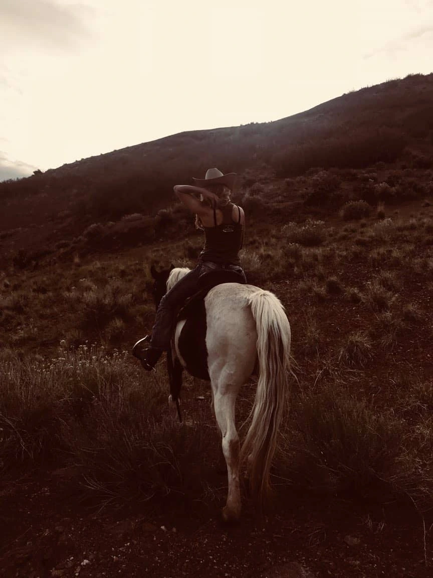 Cowgirl on paint horse